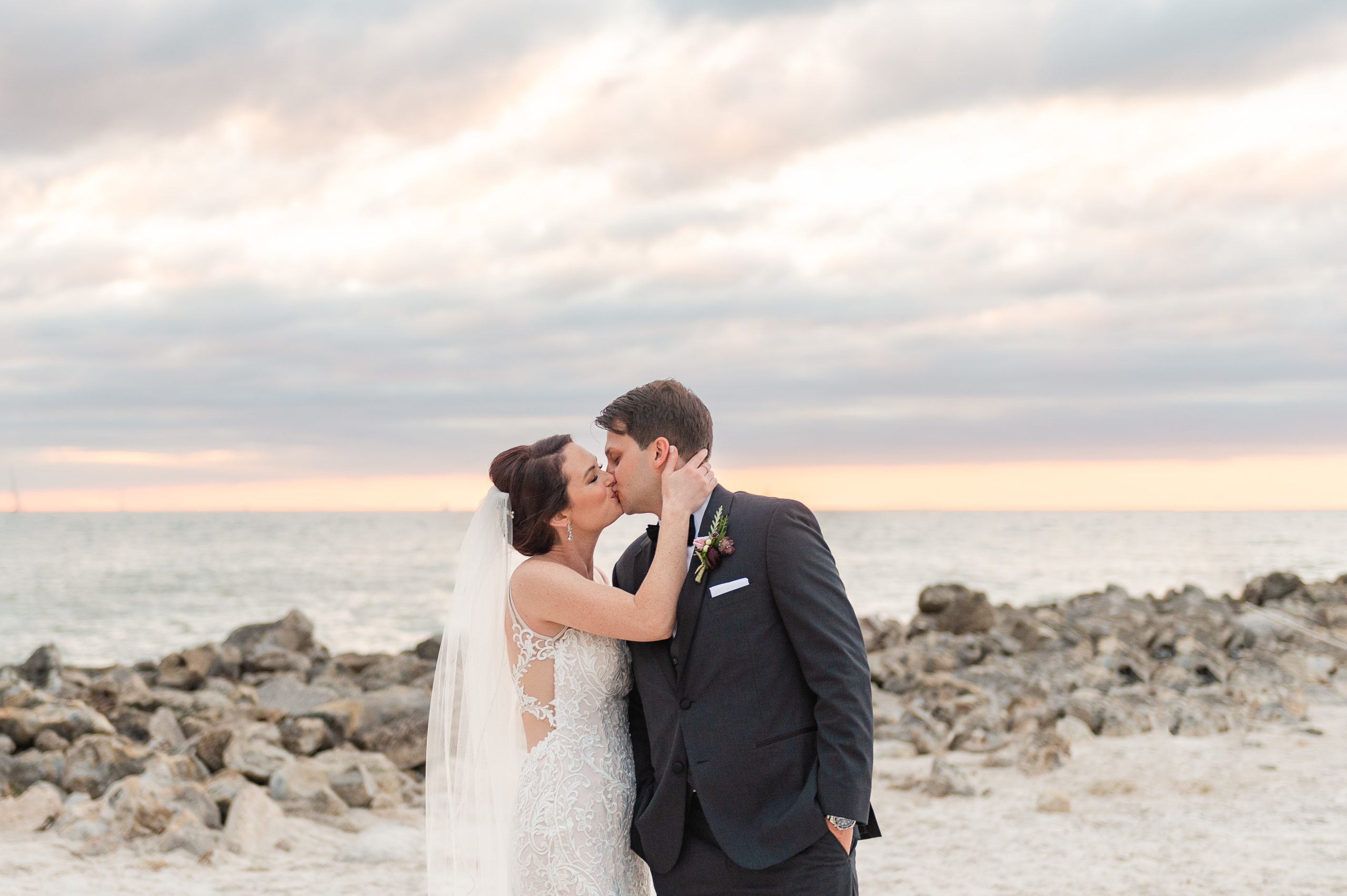 Bride and Groom kissing on the beach in Clearwater, FL