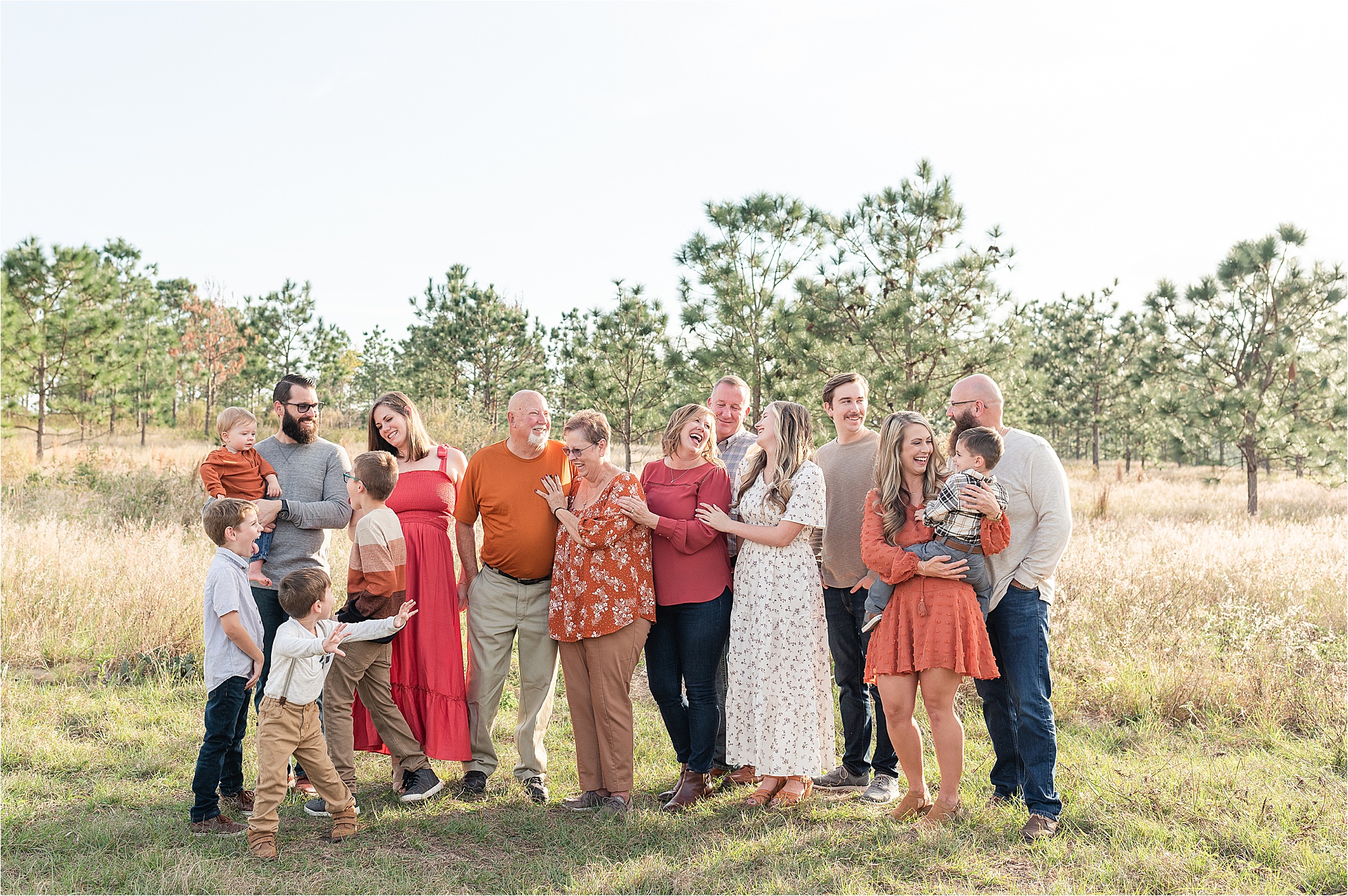 Large family laughing at each other during family photos
