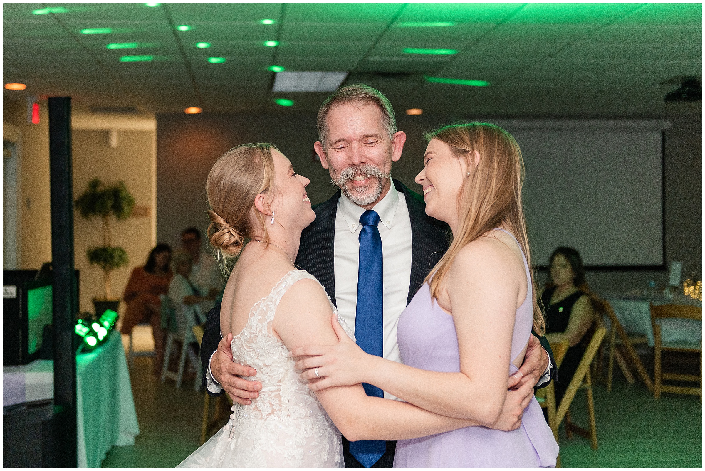 Special dance with father and his two adult daughters during a wedding reception  at Tampa Bay Watch Wedding in Tierra Verde, FL