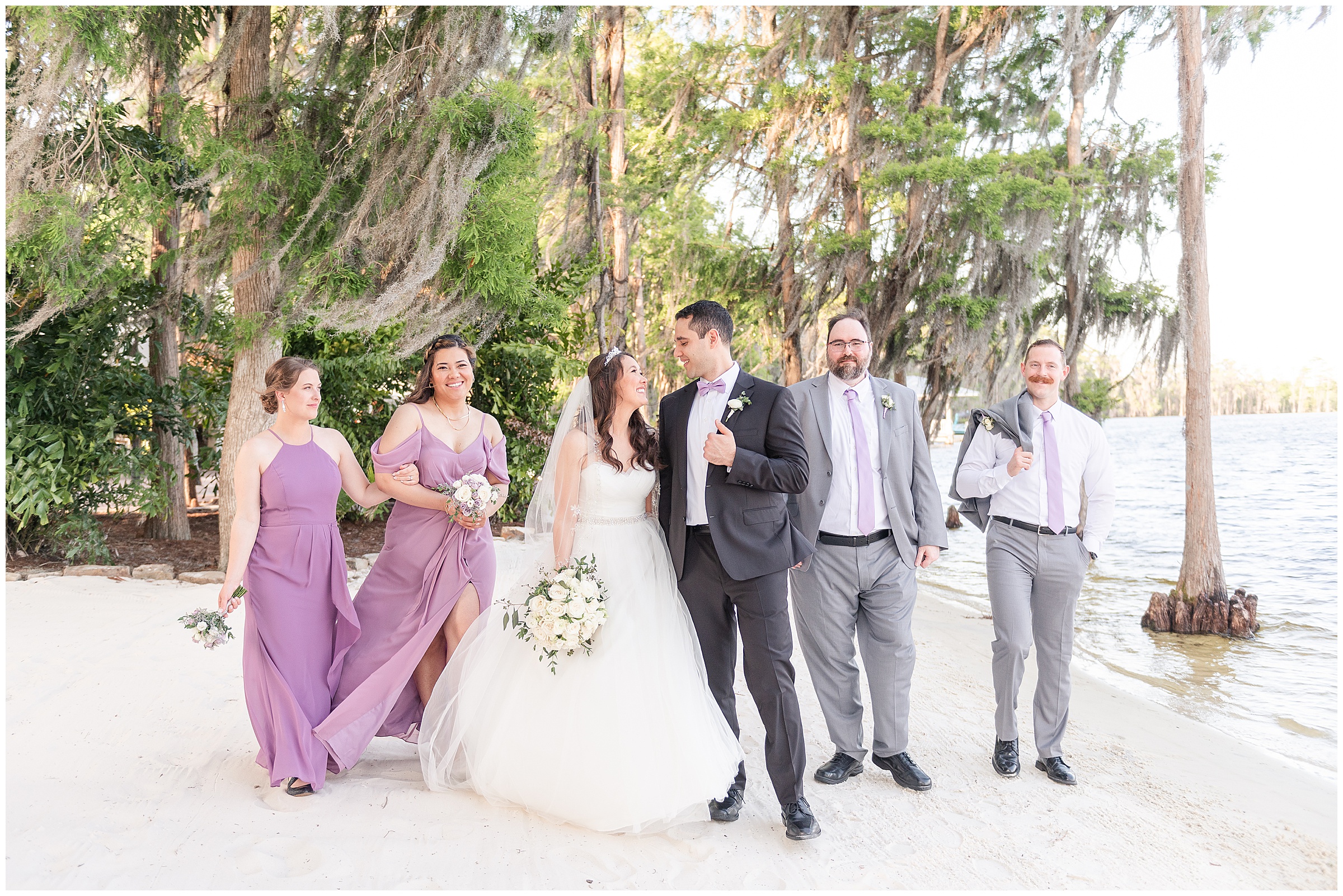 Bridal party photos on the beach at a Paradise Cove Wedding in Orlando, FL