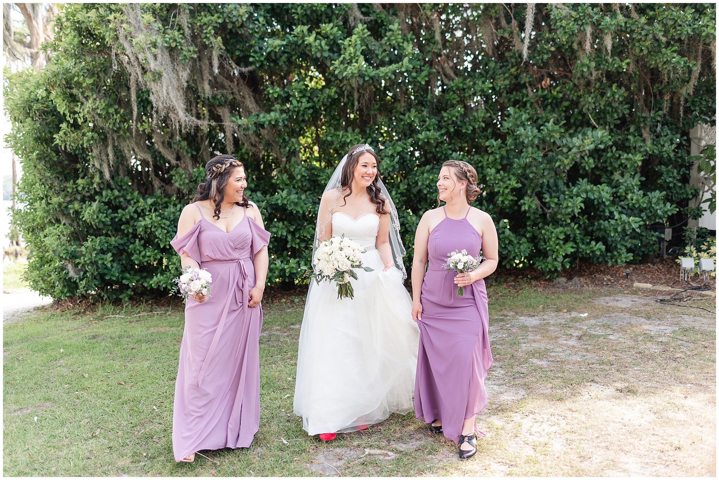 Bride and bridesmaids walking and talking at a Paradise Cove Wedding in Orlando, FL