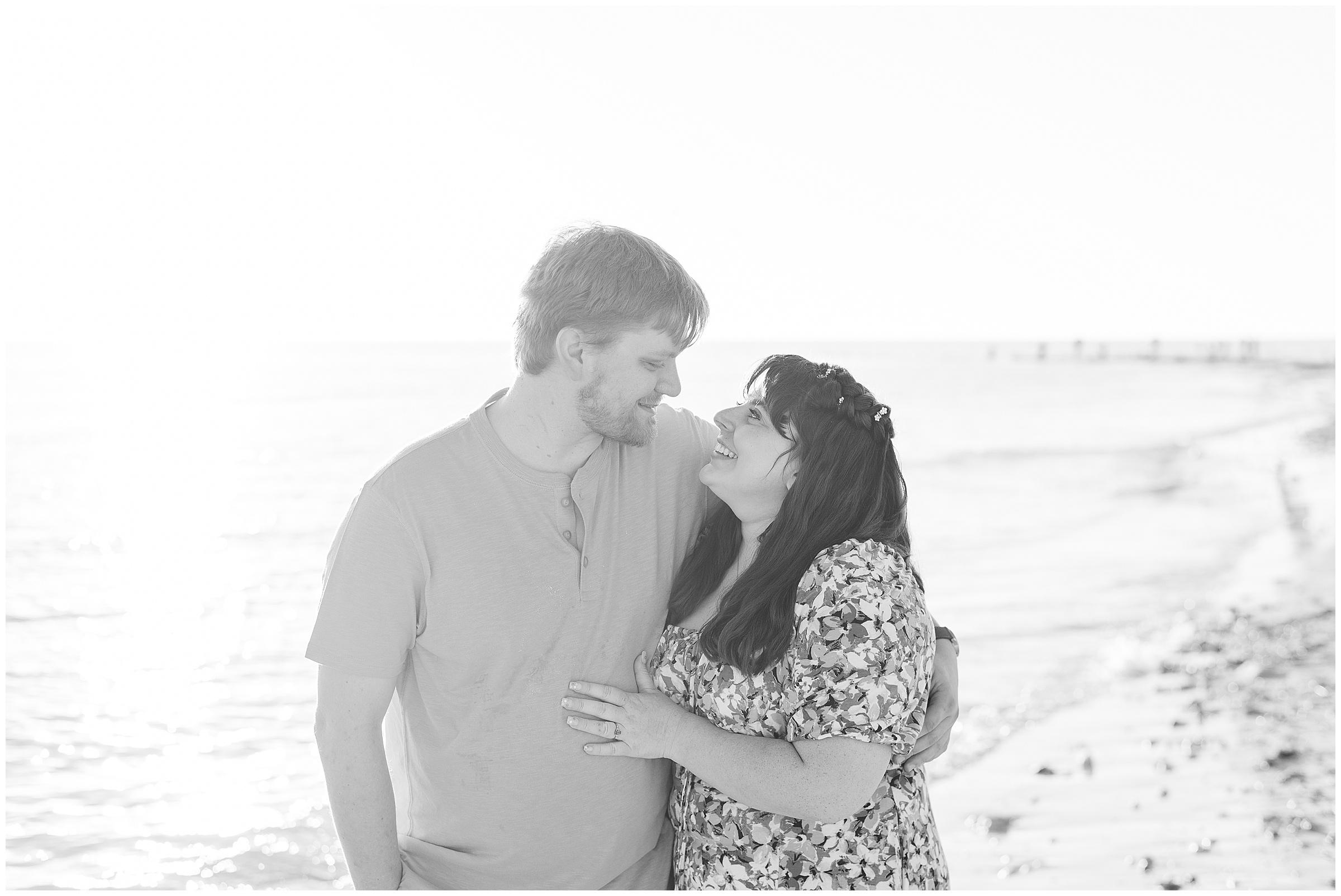 Couple walking on the beach during their Honeymoon Island Engagement Session