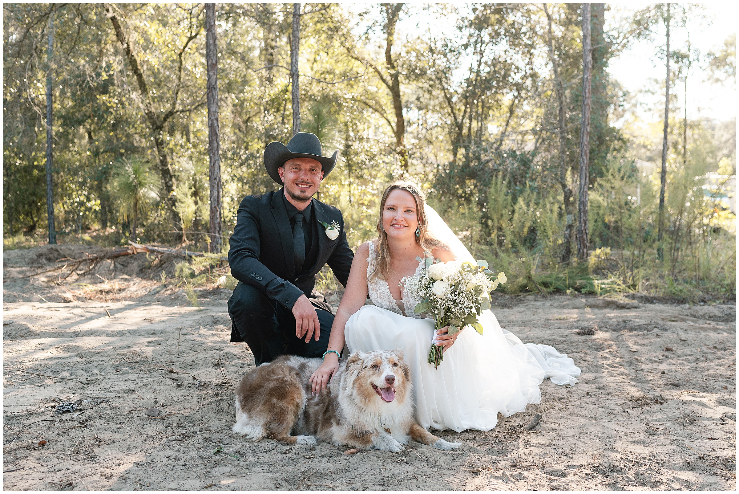 A bride and groom posing with their australian shepherd dog for wedding photos at their Ocala, FL Wedding. 